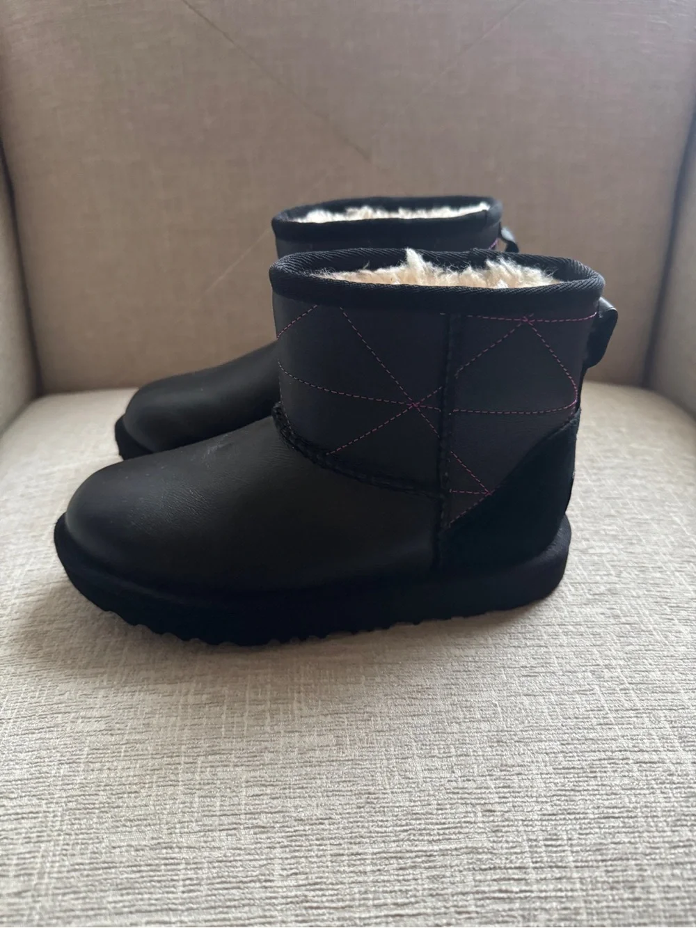 UGG Black Short Shearling Boots with Pink Stitching